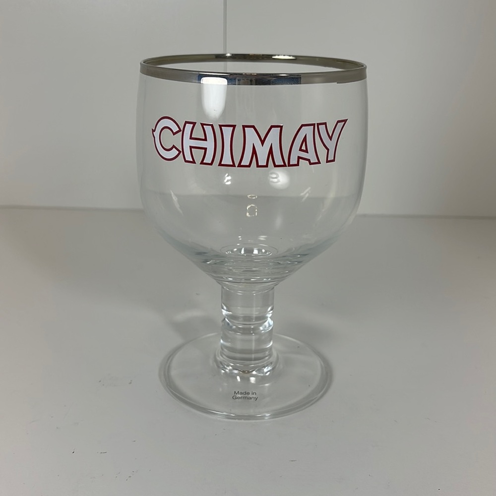 NWOT Chimay Glass with silver rim and white lettering and red outline.